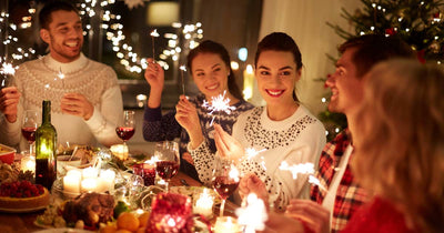 People sitting around a festive holiday table