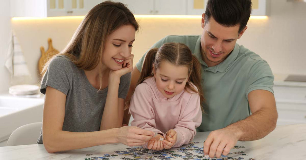 Young family working a puzzle