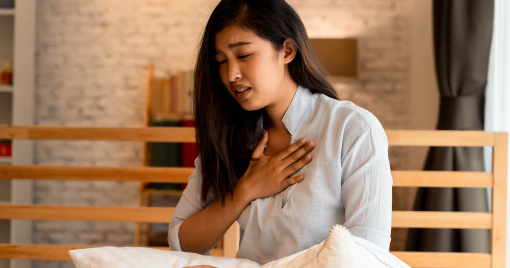 Woman having difficulty breathing