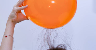 Balloon rubbed on head showing static electricity